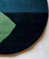 round_blue_hand_tufted_rug