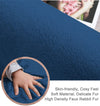 Blue rabbit fur carpet with a close-up of a hand touching it