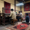 Rug_artisans_working_in_a_workshop