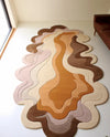Desert Bloom irregular hand tufted rug with earthy layered design styled with natural light and furniture