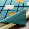 Edge and pile thickness view of wool rug showing fine hand tufted quality
