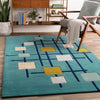Modern hand tufted wool rug in multicolor abstract pattern placed in living room