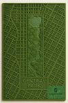 Green textured rug with a map design of Central Park and 'CarpetArtInd' branding.