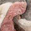Soft microfiber diamond-patterned rug in pink, grey, and cream tones
