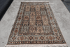 Full view of Persian heritage garden panel rug with ivory ground, floral botanical panels and layered border — Rugnoor collection