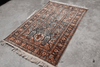 Full view of Persian heritage rug with ivory ground, central medallion and rich dark floral border — timeless design from the Rugnoor collection