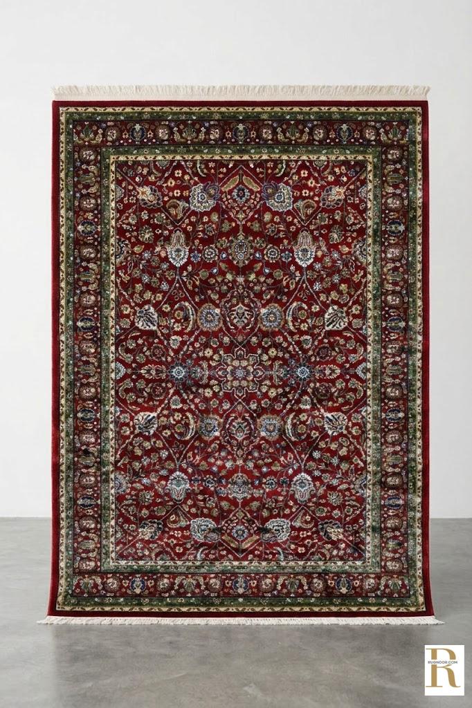 Firman Persian rug — deep crimson red with forest green border and all-over floral arabesque design, Persian Heritage Collection by Rugnoor