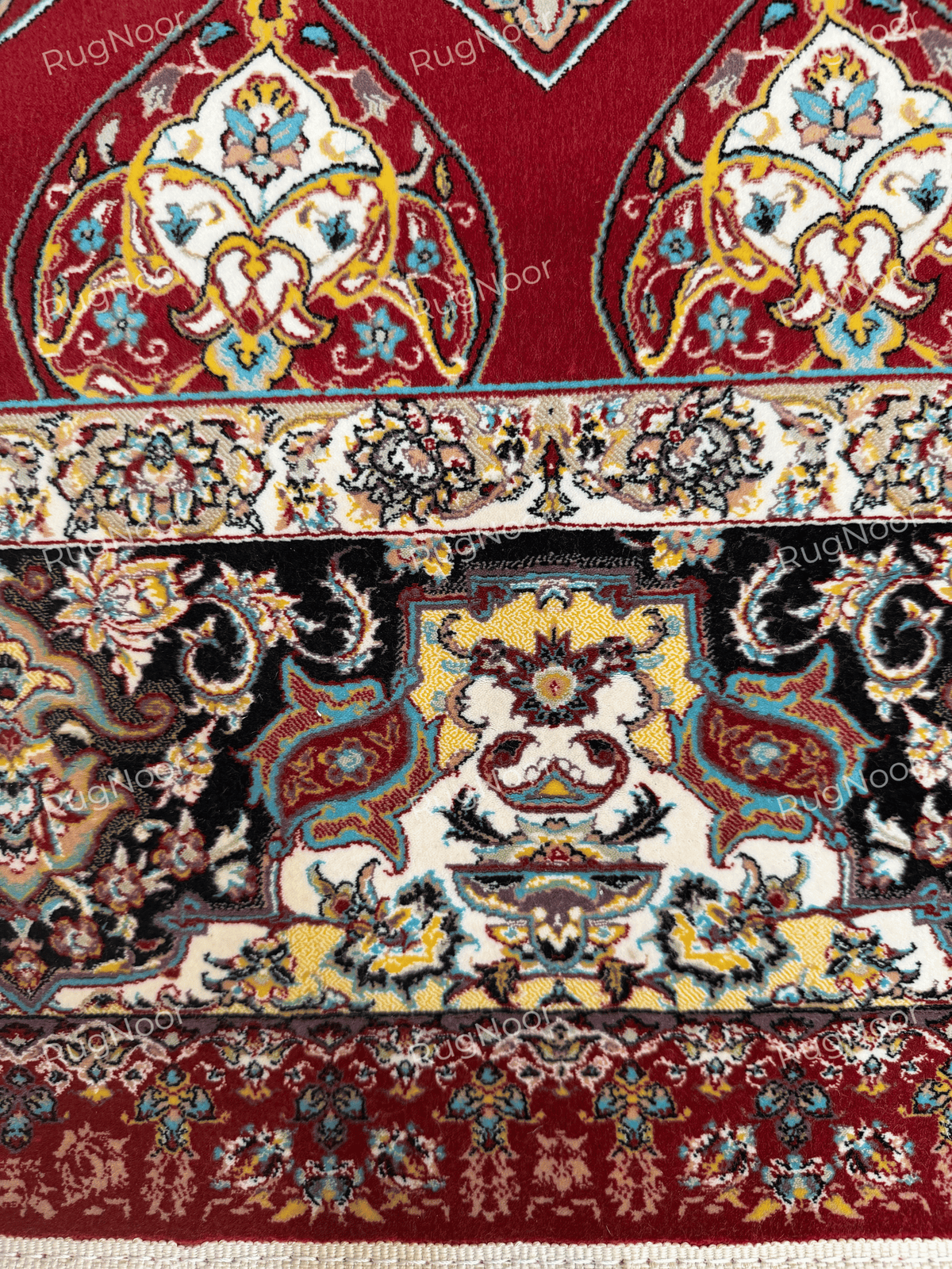 Detailed view of the cream floral border and dark decorative inner band