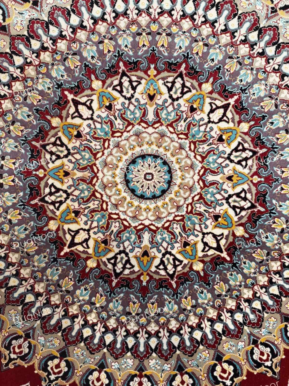 Close-up of multicolour floral motifs on the red carpet field