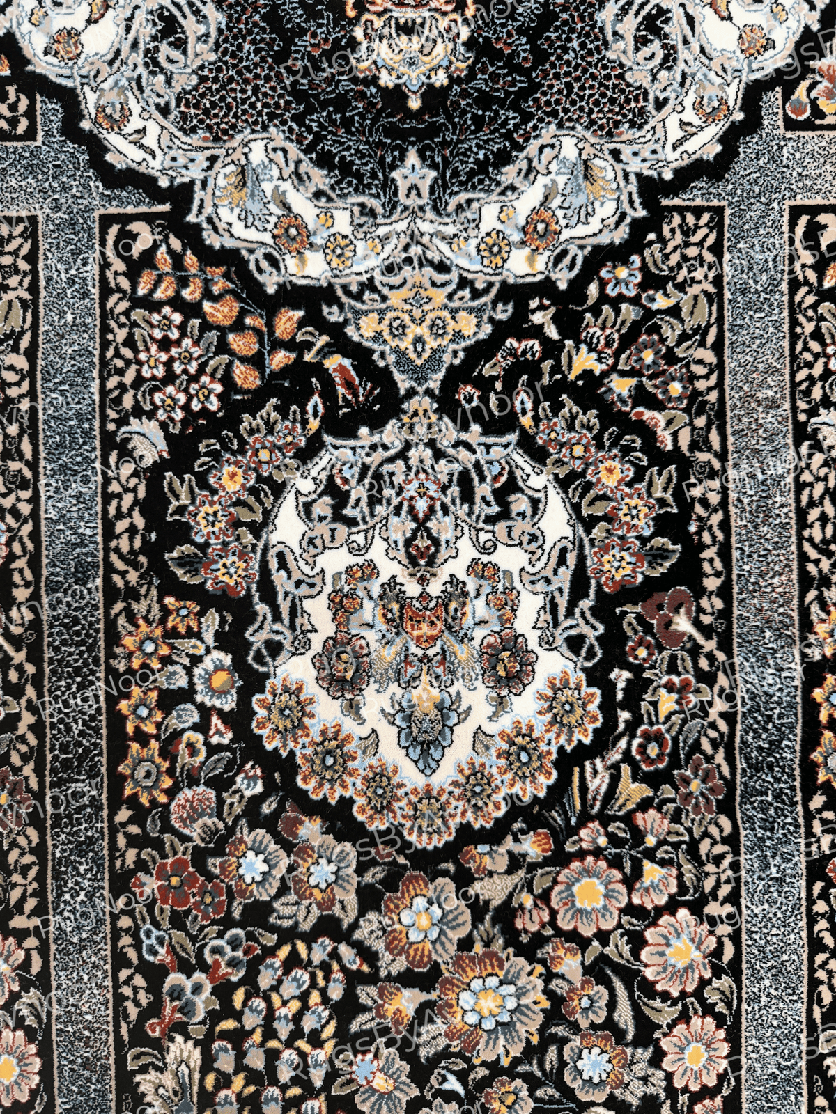 Close-up of a decorative floral panel with cream, blue, rose, and gold accents on black by RugNoor