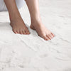 Feet on a soft white rabbit fur carpet