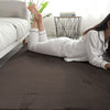Person lying on a brown rabbit fur carpet