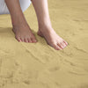 Feet standing on a camel beige rabbit fur carpet