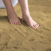 Feet standing on a golden camel rabbit fur carpet