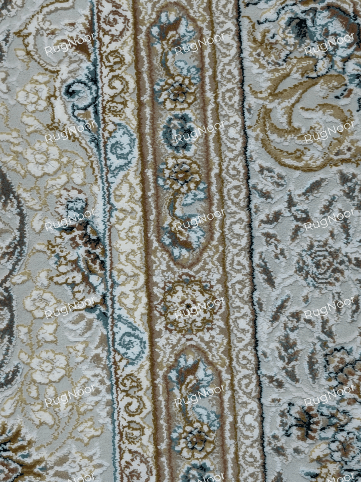 Close-up of Warda's multi-layered border with small floral motifs in ivory, grey, beige and blue, RugNoor.