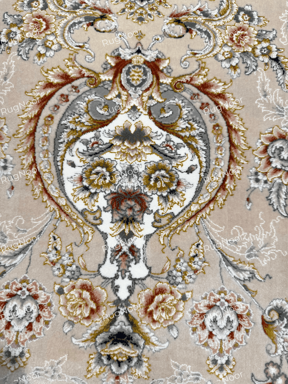 Close-up of Urkeed's scrolling floral vines, ivory blossoms and grey ornamental shapes against a beige field, RugNoor.