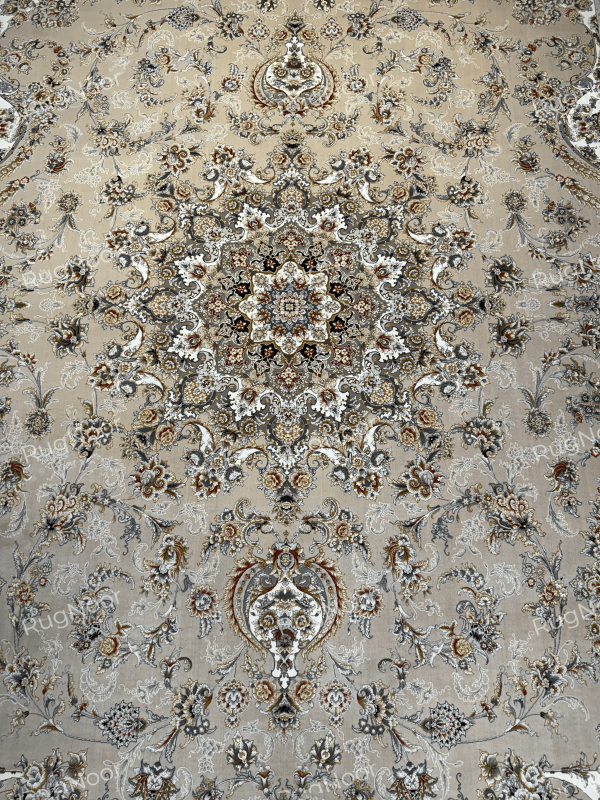 Detailed view of Urkeed's ornamental medallion with symmetrical floral motifs and muted rust and gold accents, RugNoor.