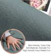 Gray rabbit fur carpet with a close-up of a hand touching it
