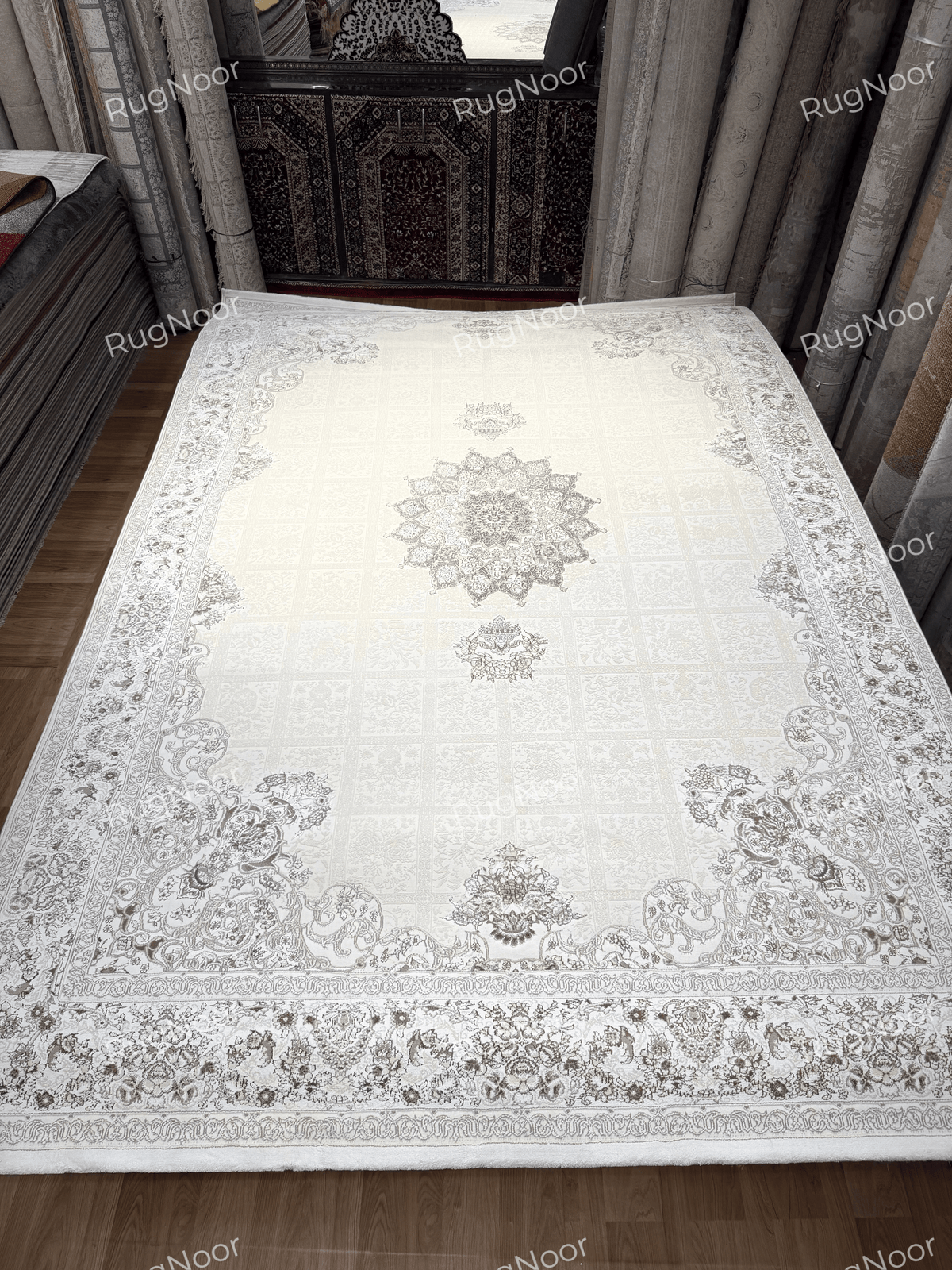 Full view of the 7x10 Parichehr ivory carpet with a central star medallion and ornate floral border, RugNoor.