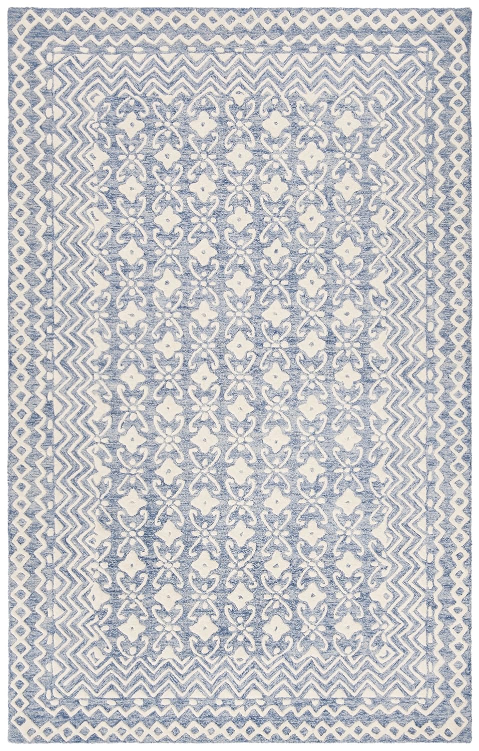 Full flat lay of the Aveline hand tufted wool rug featuring carved floral motifs and geometric borders in powder blue and ivory.