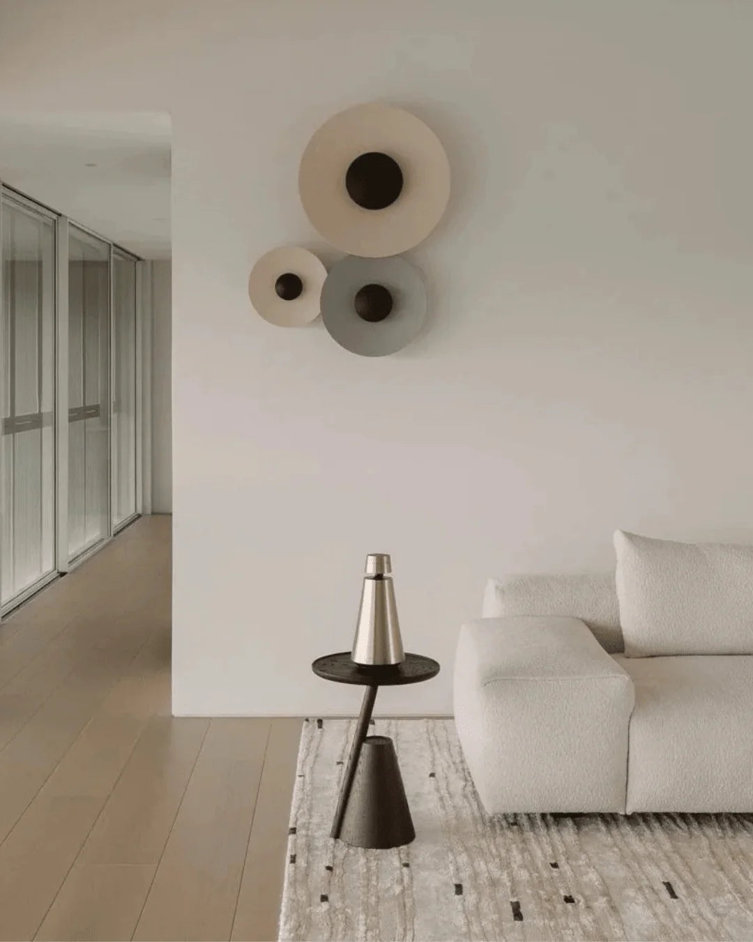 Neutral ivory Bastien contour line wool area rug with flowing organic design.