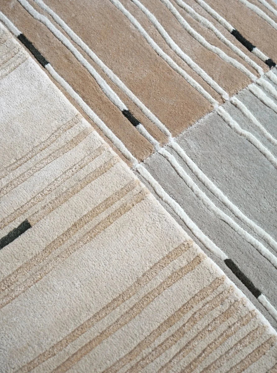 Detailed view of the organic contour line pattern on the Bastien hand tufted wool rug.