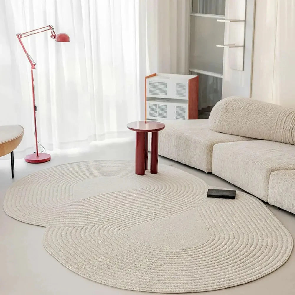 Modern living room with a ivory rug, beige sofa, and red floor lamp.
