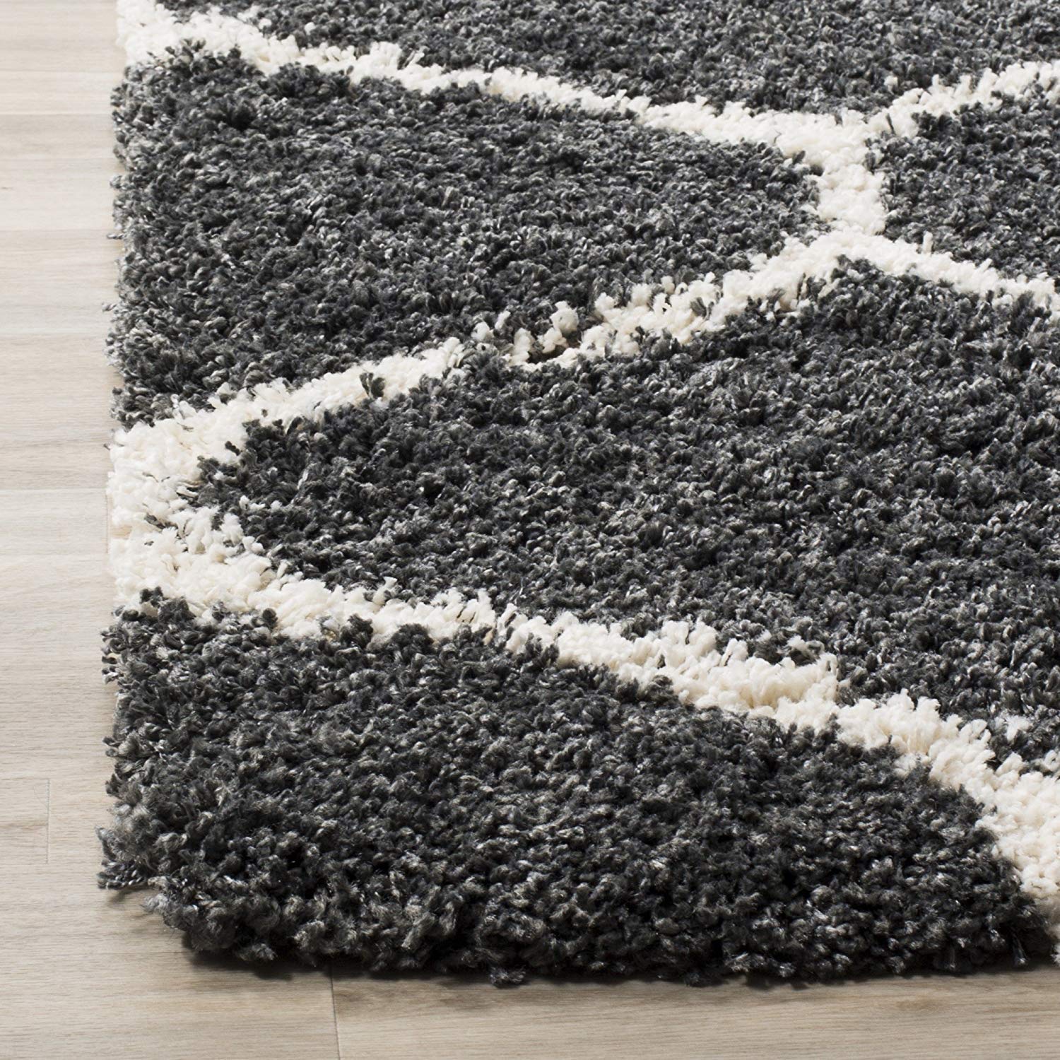 Striped gray and white rug on a wooden floor