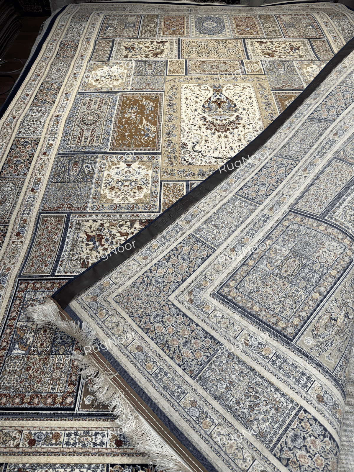 Arghavan carpet folded back to show its underside, border, and ivory fringe.