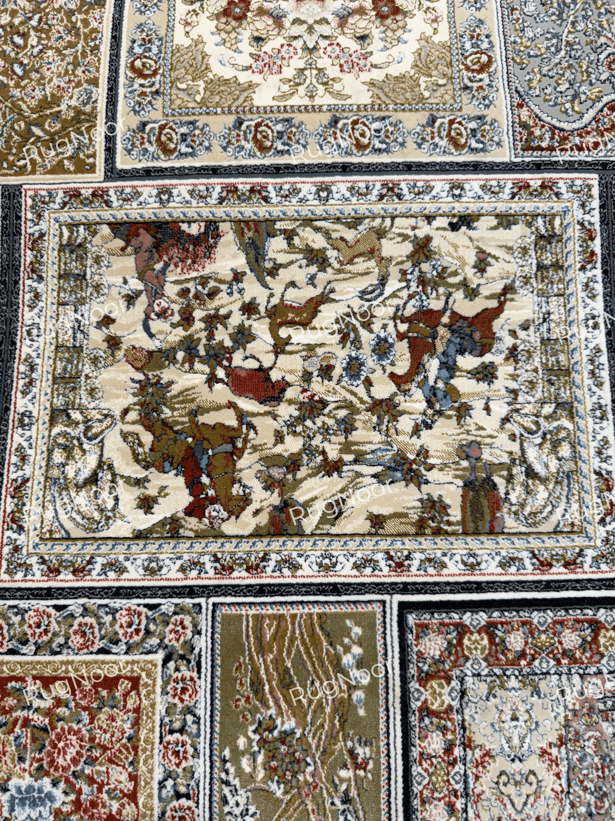 Close-up of a framed floral panel on the Arghavan carpet, featuring cream, rust, brown, blue, and muted green details.
