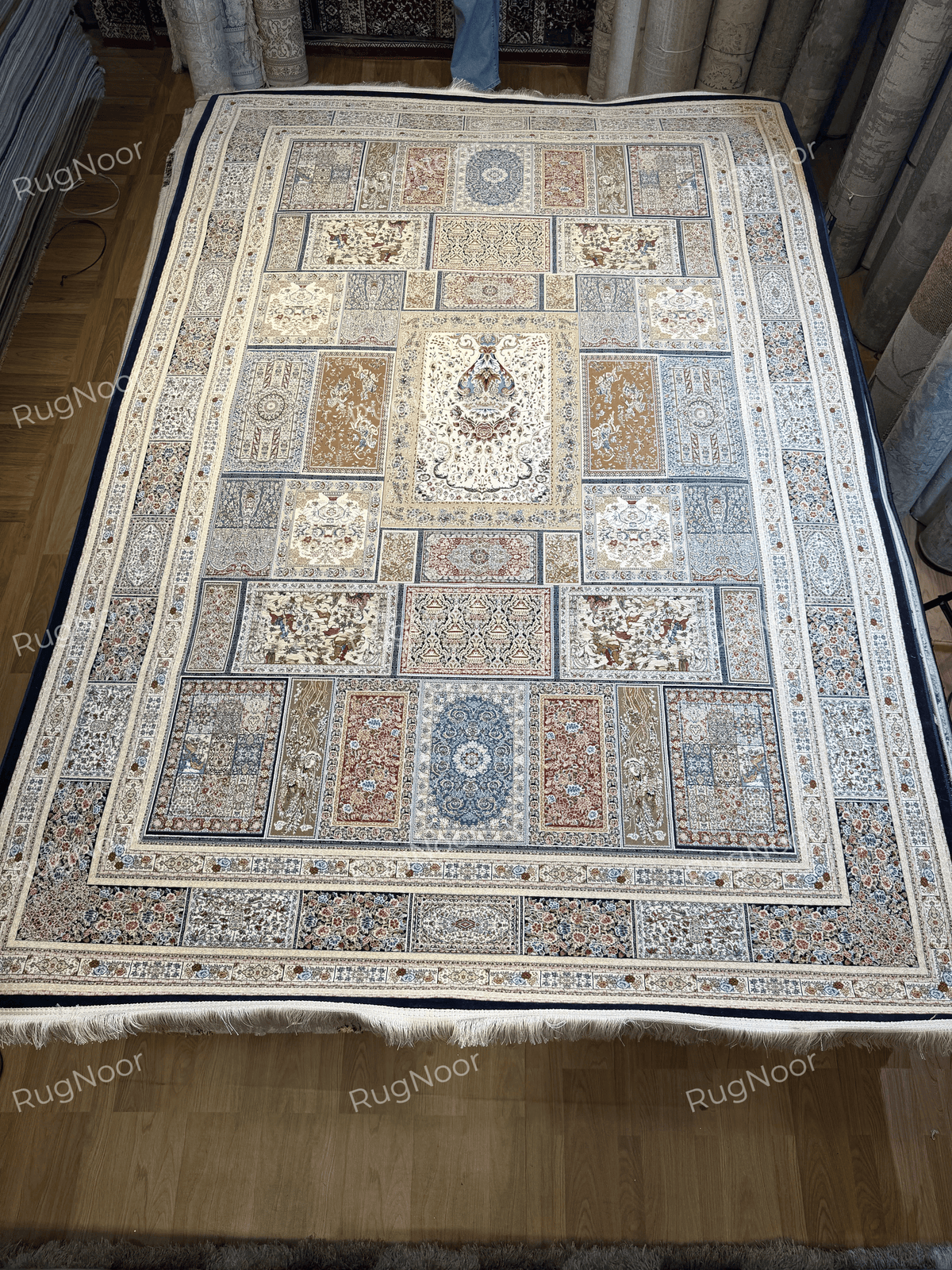 Front view of the Arghavan carpet with its symmetrical panel arrangement and traditional floral detailing.