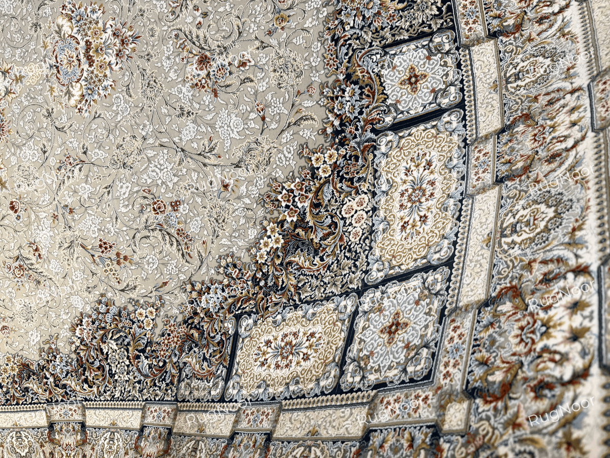 Grey-taupe Zanbaq carpet showing ivory floral vines and a navy framed border, 6x9 ft, RugNoor.