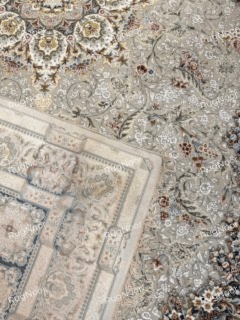 Folded corner of a carpet showing the reverse side and edge finish, RugNoor.