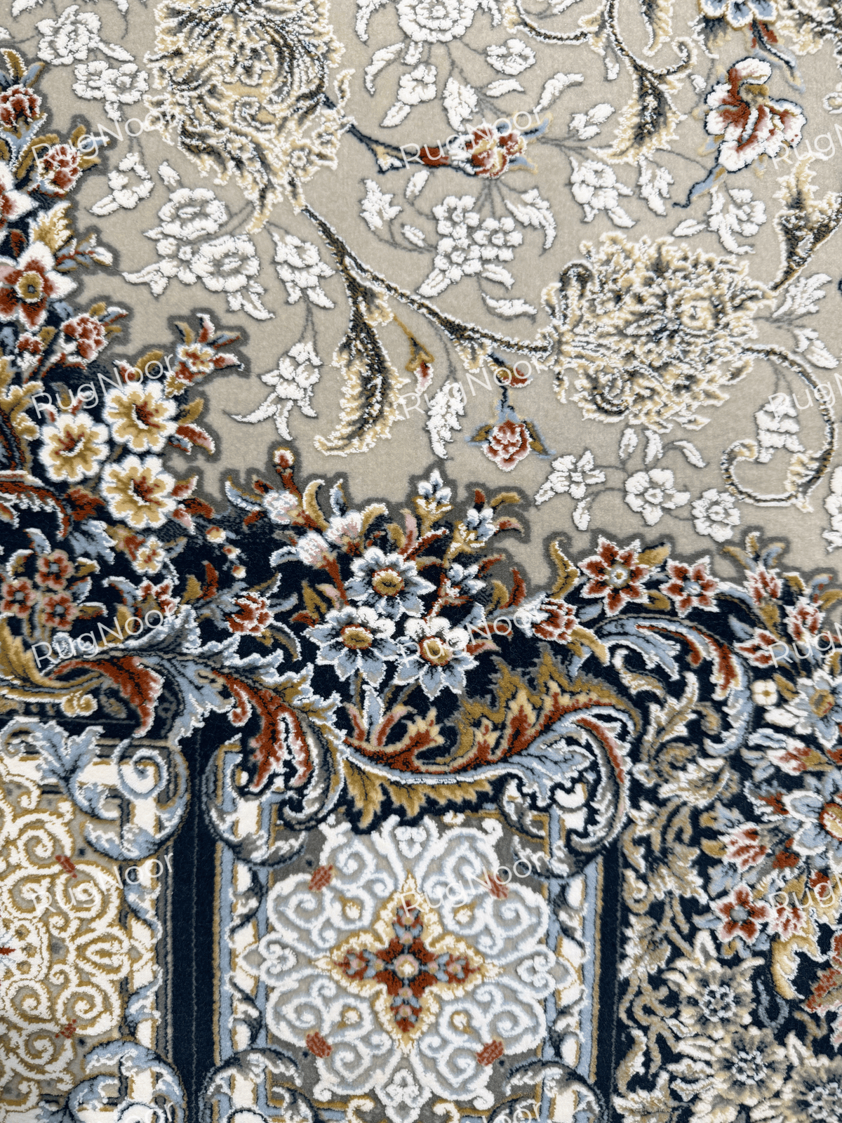 Detailed view of the ivory vine motifs against the muted grey-taupe background of Zanbaq, RugNoor.
