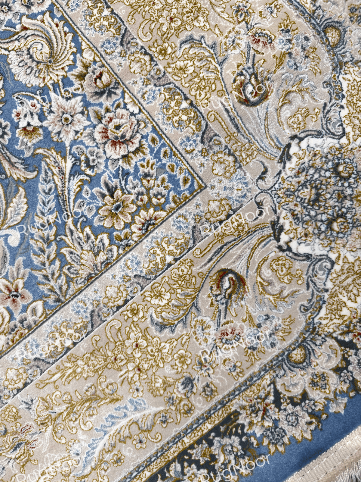 Close-up of Nardine's dusty blue floral field and ornate cream-and-gold border.