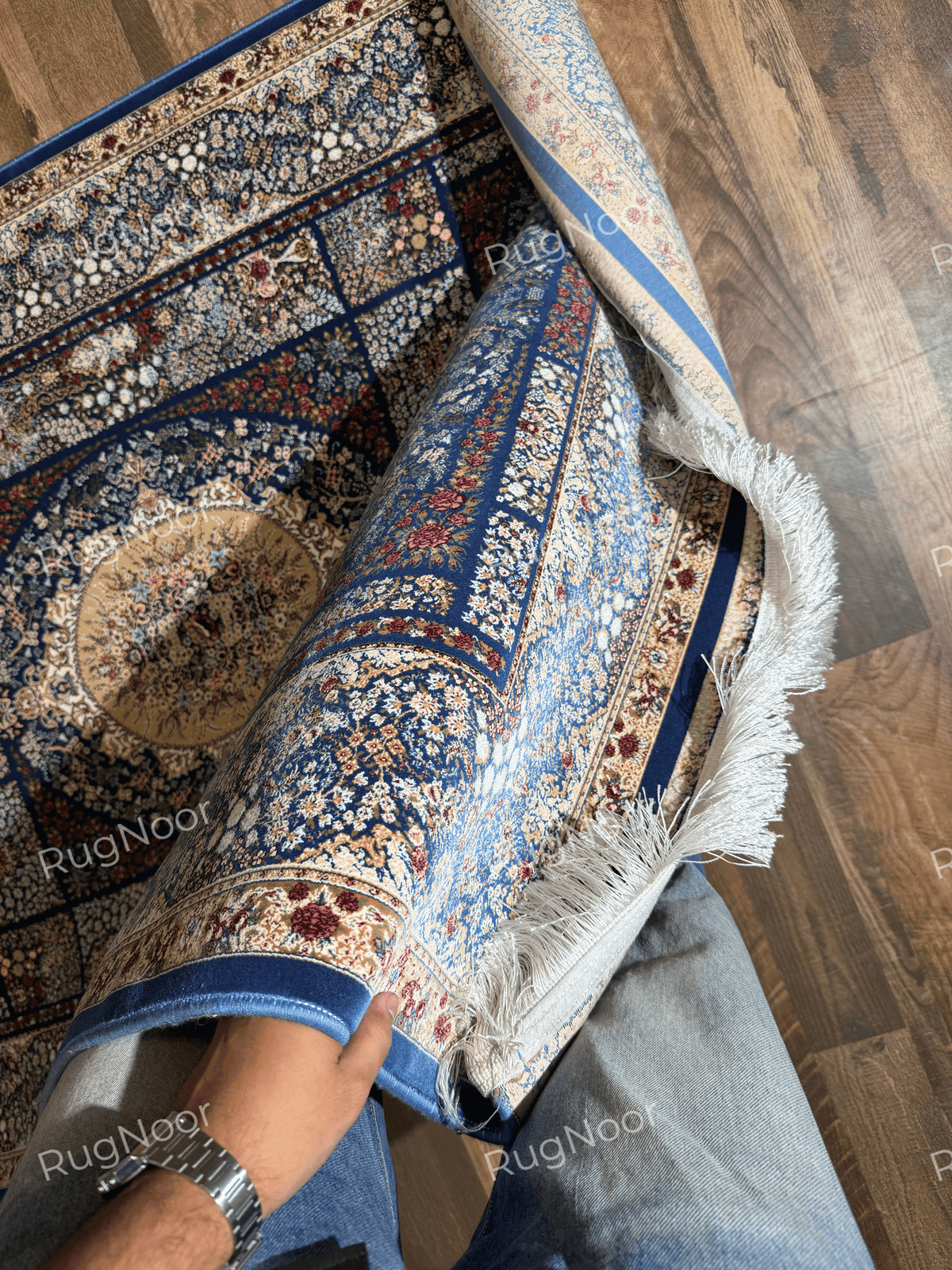 4x6 Nayrizan Bamboo Silk rug with a navy floral medallion, ivory fringe, and visible underside.