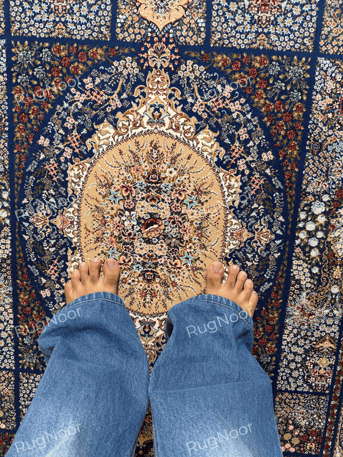 Detailed view of Nayrizan's floral medallion with ivory, gold, blue, and rust accents.