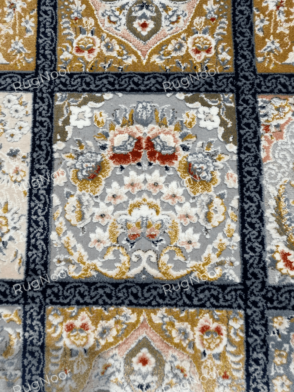 Close-up of a symmetrical floral ornament inside a Parnian panel.