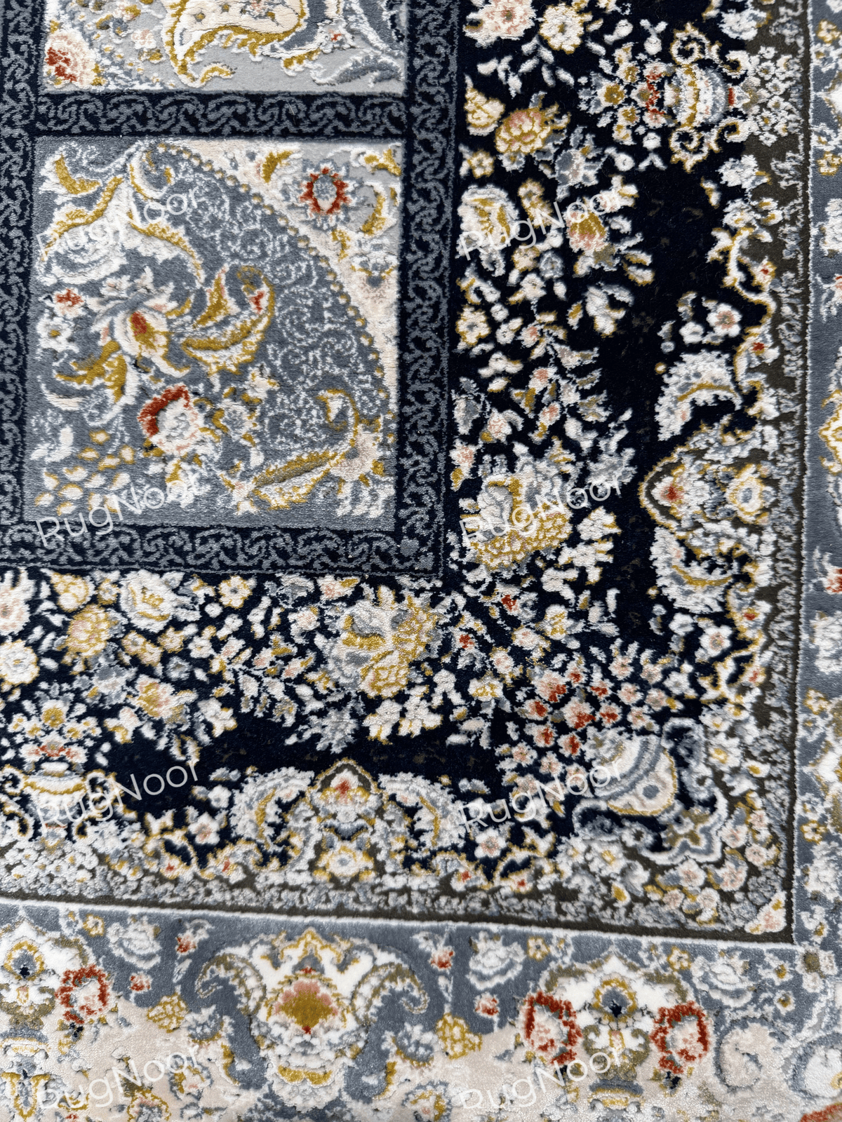 Close-up of Parnian's dark navy floral border and adjoining panels.