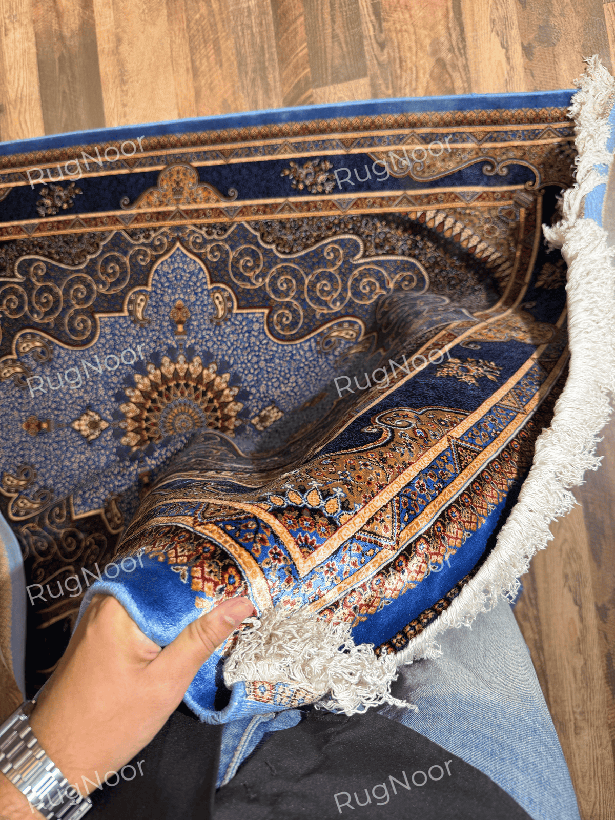 Detailed view of Yasamin's scalloped medallion and intricate floral motifs.