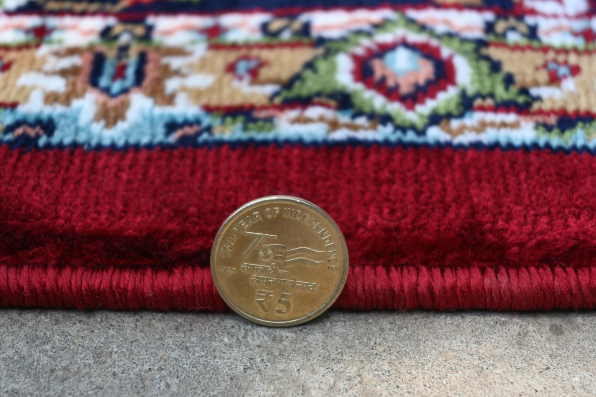 Detailed border of Zebaish Traditional Carpet with deep navy, ivory, burgundy and floral motifs
