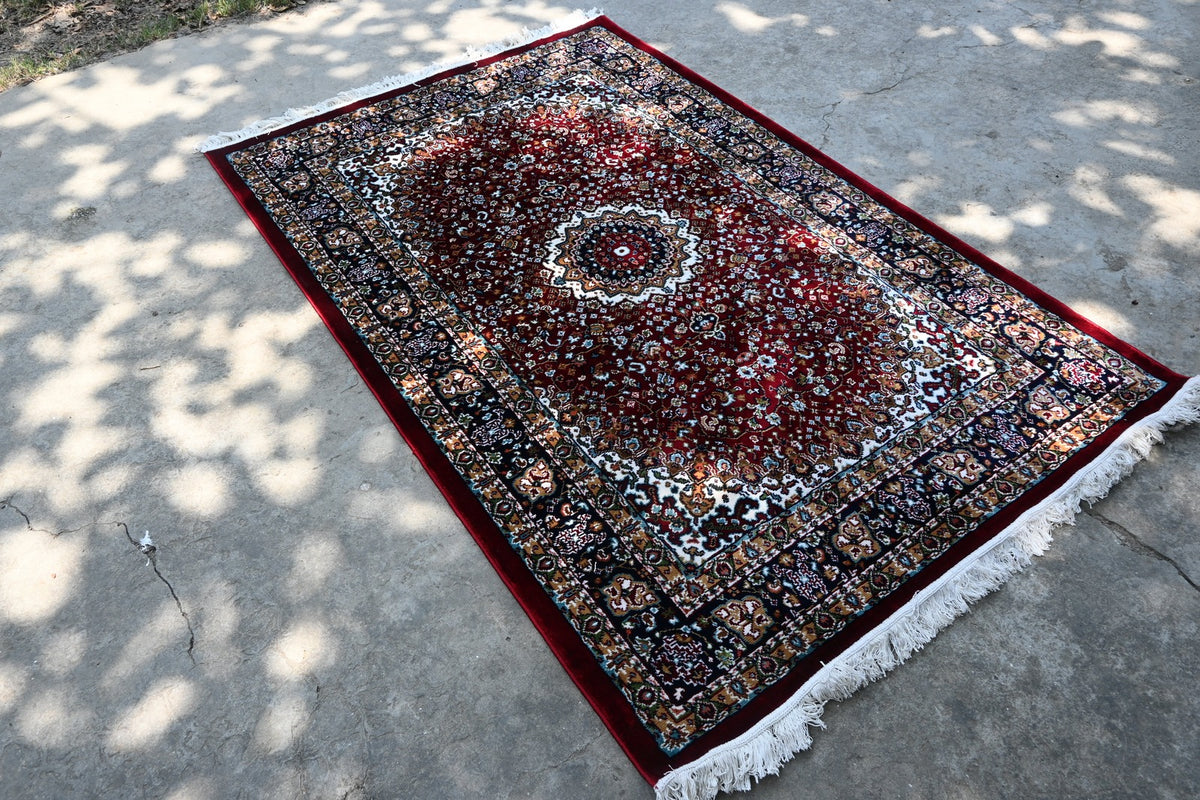Zebaish Traditional Carpet showing its intricate floral field, central medallion and layered decorative borders