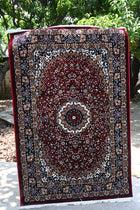 Zebaish Traditional Carpet in deep burgundy red with an ornate central medallion and intricate floral motifs
