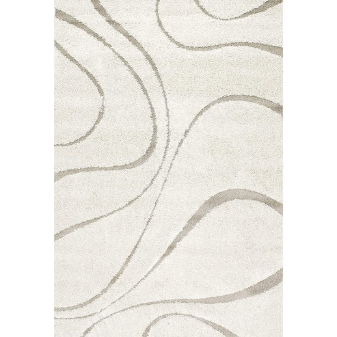 Full view of the Serenity ivory shaggy rug featuring a sculpted abstract wave design with plush texture.