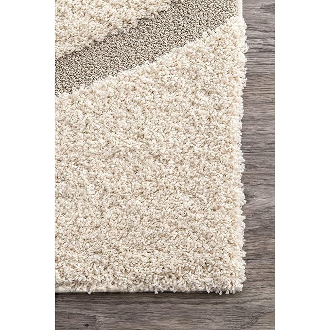 Close-up of the Serenity shaggy rug showcasing its ultra-soft high-pile texture and carved organic wave pattern.