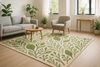 “A modern living room with a nature-inspired hand-tufted rug featuring green and organic patterns. Clean lines, cozy furniture, and fresh plants in the background, highlighting a stylish, eco-modern vibe.”