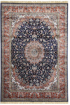 Afsaneh Royal Medallion Rug with deep navy floral field, ornate central medallion, rust border and cream fringe