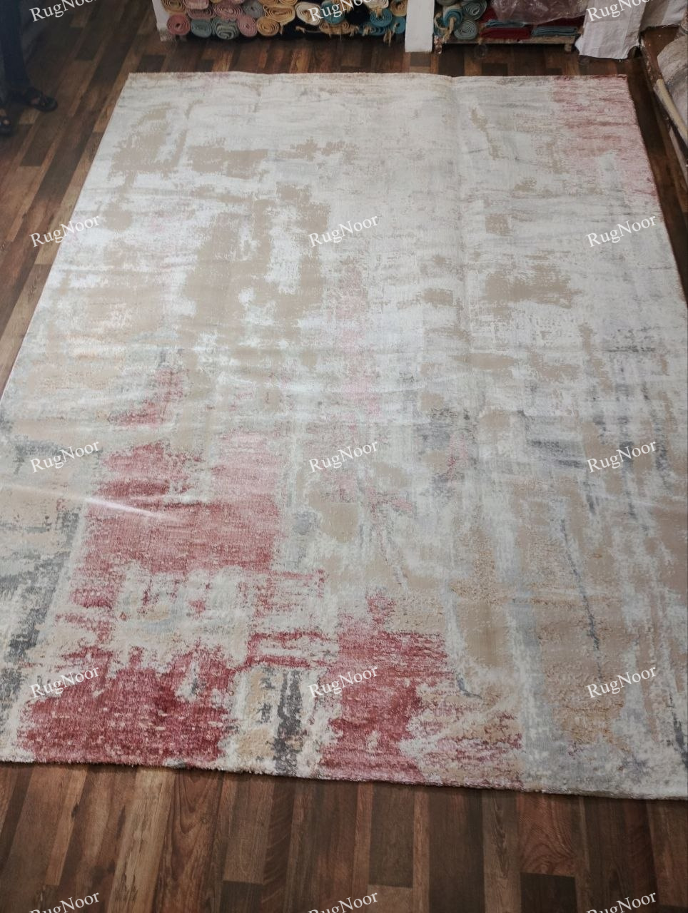 Full front view of the 9 × 12 ft Amselle modern abstract rug showing its complete distressed pattern and muted colour palette.