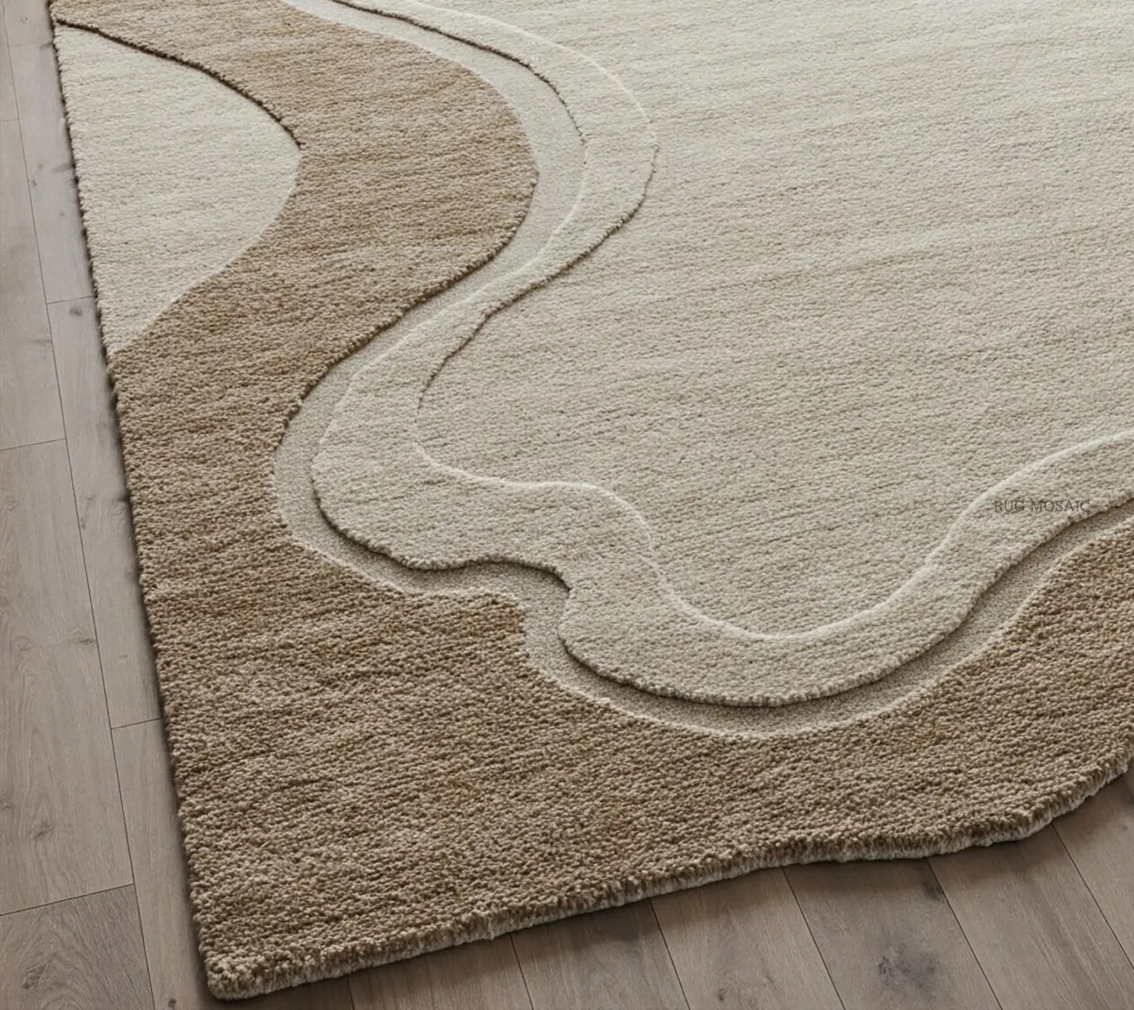 A close-up of a textured area rug with a wavy, organic pattern in beige and cream tones, shown on a light wood floor.