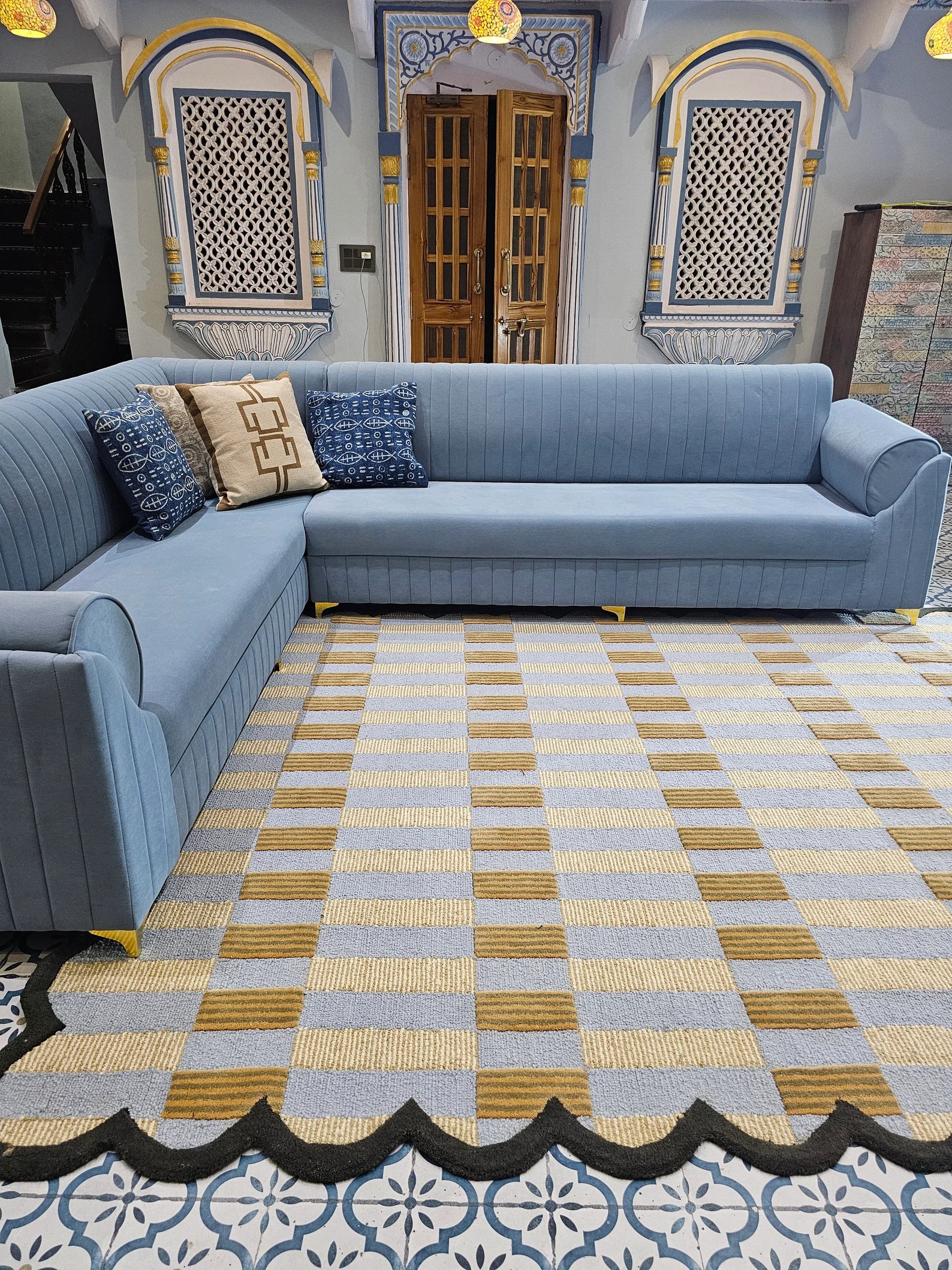 black scalloped rug in luxury indian living room with sofa